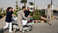 A tourist, who was injured in a stabbing, is rushed into King Hussein Medical Center in Amman, Jordan November 6, 2019. REUTERS/Muhammad Hamed