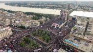 An aerial view shows Iraqi protesters gathering at Baghdad's Tahrir square near al-Jumhuriya bridge which leads to the high-security Green Zone across the Tigris River, during ongoing anti-government demonstrations on November 2, 2019.  AFP