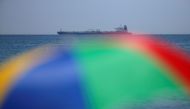 The oil supertanker Grace 1 sits anchored in waters of the British overseas territory of Gibraltar, seen from the Spanish city of La Linea de la Concepcion, July 4, 2019. Reuters / Jon Nazca