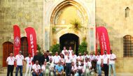 Visitors from Qatar posing for a group picture with other officials from Auto Class Cars, which hosted them in Lebanon.