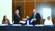 Shamsul Kahar Haron, CEO of International Islamic College, Malaysia (second left) shaking hands with Ammar Rayess (second right), Managing Partner, Atmosphere Projects, at the MoU signing ceremony in Doha, on Thursday. Present were Mohamad Shahir Sabarudi