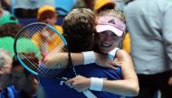 Kristina Mladenovic of France celebrates her victory against Ashleigh Barty of Australia with team's captain Julien Benneteau during the third rubber of the Fed Cup tennis final match between Australia and France in Perth on November 10, 2019. / AFP