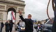 French President Emmanuel Macron waves as he leaves a ceremony at the Arc de Triomphe as part of commemorations marking the 101st anniversary of the 11 November 1918 armistice, ending World War I, in Paris, France November 11, 2019. Ludovic Marin/Pool via