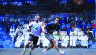Qatar’s Abdulla Al Tamimi (left) in action against Egyptian No.2 seed Tarek Momen during their PSA World Championship last-16 match at the Khalifa International Tennis and Squash Complex, yesterday.