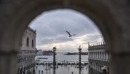 A general view shows the Doge's Palace (L) overlooking the flooded St. Mark's Square, the Lion of St. Mark winged bronze statue (Rear L), gondolas and the Venetian lagoon in the distance after an exceptional overnight 