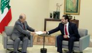 FILE PHOTO: PM Saad Hariri hands President Michel Aoun resignation at the Baabda presidential palace Beirut on October 29, 2019 bowing to nearly two weeks of unprecedented nationwide protests. AFP / Dalati And Nohra handout