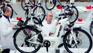 Pierre Forte (R)  founder CEO of Pragma Industries and Alexandre Blanc (L) operations director, check an Alpha bike at the Pragma Industries factory in Biarritz, France, January 15, 2018. Reuters / Regis Duvignau