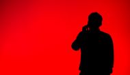 A visitor speaks on his mobile phone during the Mobile World Congress on the third day of the MWC in Barcelona on March 1, 2017. AFP / Josep Lago