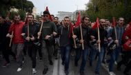 Students shout slogans during the annual march towards the US embassy on November 17, 2019 in Athens, to mark the 1973 students' uprising against the US-backed military junta.  / AFP / ARIS MESSINIS 