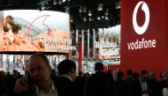 People visit the Vodafone stand at the Mobile World Congress in Barcelona on February 25, 2019. AFP / Pau Barrena