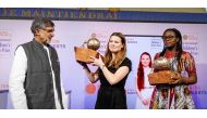 Indian children's right's activist and 2014 Nobel Peace Prize Laureate Kailash Satyarthi (L) presents the International Children's Peace Prize 2019 to German climate activist Luisa Neubauer (C) and Cameroonian peace activist Divina Maloum in The Hague on 