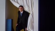 Brazilian President Jair Bolsonaro enters the stage prior to deliver a speech during the World Economic Forum annual meeting on January 22, 2019 in Davos. AFP / Fabrice Coffrini