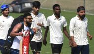 India's cricket team captain Virat Kohli (2nd L) walks after a practice session at The Eden Gardens cricket stadium in Kolkata on November 21, 2019, ahead of the second Test cricket match between India and Bangladesh. / AFP / Dibyangshu SARKAR 