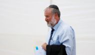 Israeli Attorney-General Avichai Mandelblit holds documents as he attends a weekly cabinet meeting in the Jordan Valley, in the Israeli-occupied West Bank September 15, 2019. Reuters/Amir Cohen