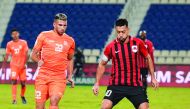 Al Rayyan captain Rodrigo Tabata (right) in action against Umm Salal’s Murad Naji during their Ooredoo Cup Group A match at Al Khor Stadium yesterday. The match ended in an exciting 2-2 draw.PICS: Salim Matramkot/The Peninsula and QSL Twitter