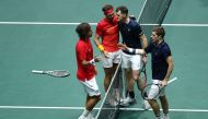 Spain's Rafael Nadal (2L) and Spain's Feliciano Lopez (L) are congratulated by Great Britain's Jamie Murray (2R) and Great Britain's Neal Skupski after winning the semi-final doubles tennis match between Great Britain and Spain at the Davis Cup Madrid Fin