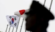 Japan and South Korea national flags at a hotel where South Korean embassy in Tokyo Japan is holding reception to mark the 50th anniversary of normalisation of ties June 22, 2015. Reuters / Toru Hanai