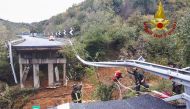 This November 24, 2019 handout photo by the Vigili del Fuoco, Italian Department of firefighters, shows a viaduct section of the A6 highway between Turin and Savona collapsed following a landslide near Savona. AFP / Vigili Del Fuoco
 