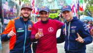 Qatar’s Nasser Al Attiyah (centre), Australian Toby Price (left) and Mathieu Baumel pose for a picture during the Baja 1000 in Mexico.