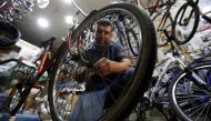 A man repairs a bike wheel at a bicycle shop in Beirut, Lebanon, August 30, 2017. Reuters / Mohamed Azakir