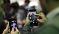 Visitors try devices during Mobile World Congress in Barcelona February 27, 2017. Reuters / Eric Gaillard