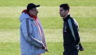 Juventus' Italian coach Maurizio Sarri (L) talks to Juventus' Portuguese forward Cristiano Ronaldo on November 25, 2019 during a training session at the Continassa Training Ground in Turin, on the eve of the UEFA Champions League Group D football match Ju