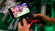 A gamer plays a cloud-based coputer game of Project X Cloud of Microsoft during Gamescom in Cologne, Germany, August 21, 2019. Reuters / Wolfgang Rattay