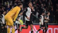 Juventus' Argentine forward Paulo Dybala celebrates after opening the scoring during the UEFA Champions League Group D football match Juventus Turin vs Atletico Madrid on November 26, 2019 at the Juventus Allianz stadium in Turin. / AFP / Marco Bertorello