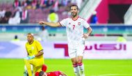 UAE’s forward Ali Mabkhout celebrates after scoring a goal against Yemen during their Group A match of the 24th Arabian Gulf Cup at the Abdullah bin Khalifa Stadium in Doha, yesterday.