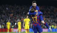 Barcelona's French forward Antoine Griezmann (L) celebrates his goal with Barcelona's Argentine forward Lionel Messi during the UEFA Champions League Group F football match between FC Barcelona and Borussia Dortmund at the Camp Nou stadium in Barcelona, o