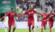 Qatar's defender Abdelkarim Hassan (C) celebrates after scoring during the 24th Arabian Gulf Cup Group A football match between Yemen and Qatar at the Khalifa International Stadium in the Qatari capital Doha on November 29, 2019. AFP / Karim Jaafar
 