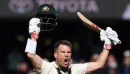 Australia's batsman David Warner celebrates reaching his triple century (300 runs) during day two of the second cricket Test match between Australia and Pakistan in Adelaide on November 30, 2019. AFP / William WEST / 