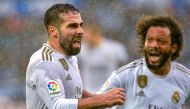 Real Madrid's Spanish defender Daniel Carvajal (L) celebrates after scoring a goal during the Spanish league football match between Deportivo Alaves and Real Madrid CF at the Mendizorroza stadium in Vitoria on November 30, 2019. / AFP / ANDER GILLENEA