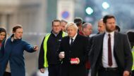 Britain's Prime Minister Boris Johnson (C) visits the scene of a stabbing, on London Bridge in the City of London on November 30, 2019. AFP / POOL / SIMON DAWSON