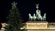 An illuminated Christmas tree is pictured in front of the Brandenburg Gate in Berlin, Germany, December 1, 2019. Reuters/Fabrizio Bensch
 