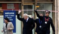 Britain's Prime Minister Boris Johnson, (C), Britain's Home Secretary Priti Patel, (L) and Commissioner of the City of London Police, Ian Dyson (R) arrive at the scene of a stabbing, on London Bridge in the City of London on November 30, 2019. AFP / Simon