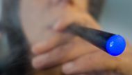 A woman smoking e-cigarette in Washington. AFP / Paul J Richards