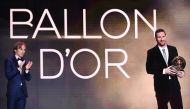 Barcelona's Argentinian forward Lionel Messi reacts after winning the Ballon d'Or France Football 2019 trophy next to Real Madrid's Croatian midfielder and last year's Ballon d'Or winner Luka Modric at the Chatelet Theatre in Paris on December 2, 2019. AF
