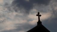 Storm clouds pass over a Roman Catholic church in Pittsburgh, Pennsylvania, US, August 14, 2018. Reuters/Jason Cohn  