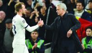 Tottenham Hotspur's Portuguese head coach Jose Mourinho (R) congratulates Tottenham Hotspur's Danish midfielder Christian Eriksen after the UEFA Champions League Group B football match between Tottenham Hotspur and Olympiakos at the Tottenham Hotspur Stad