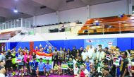 Players and officials pose for a group photo after the conclusion of Qatar Oruma Open Badminton Championship 2019.