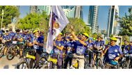 H E Ambassador P Kumaran flags off the cycle rally at Doha Corniche.