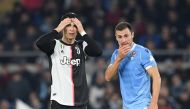 Juventus' Cristiano Ronaldo and Lazio's Stefan Radu react REUTERS/Alberto Lingria