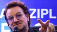 U2 frontman singer Bono speaks to the media during a signing ceremony in Manila on December 10, 2019. AFP / Maria Tan 