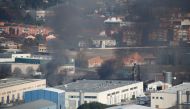 Smoke rises from a fire in a chemical plant outside of Barcelona, Spain December 11, 2019. REUTERS/Albert Gea