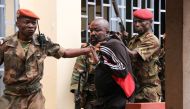 In this file photo taken on October 29, 2018 members of the armed forces arrest Central African MP Alfred Yekatom aka 
