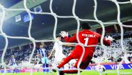 Al Sadd SC’s Baghdad Bounedjah scores their first goal  against Hienghene Sport  during their opening match of the FIFA Club World Cup at the Jassim Bin Hamad Stadium in Doha, yesterday.