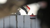  Iraqi security forces observe protesters from their checkpoint at al-Sinek bridge in the capital Baghdad amid ongoing anti-government demonstrations on December 12, 2019. / AFP / AHMAD AL-RUBAYE