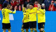 Borussia Dortmund's Nico Schulz celebrates scoring their fourth goal with teammates REUTERS/Ralph Orlowski 