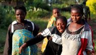 File Photo: A woman reacts after five other women were killed in Paida, near Beni, North Kivu Province of Democratic Republic of Congo, December 7, 2018. Reuters/Goran Tomasevic 